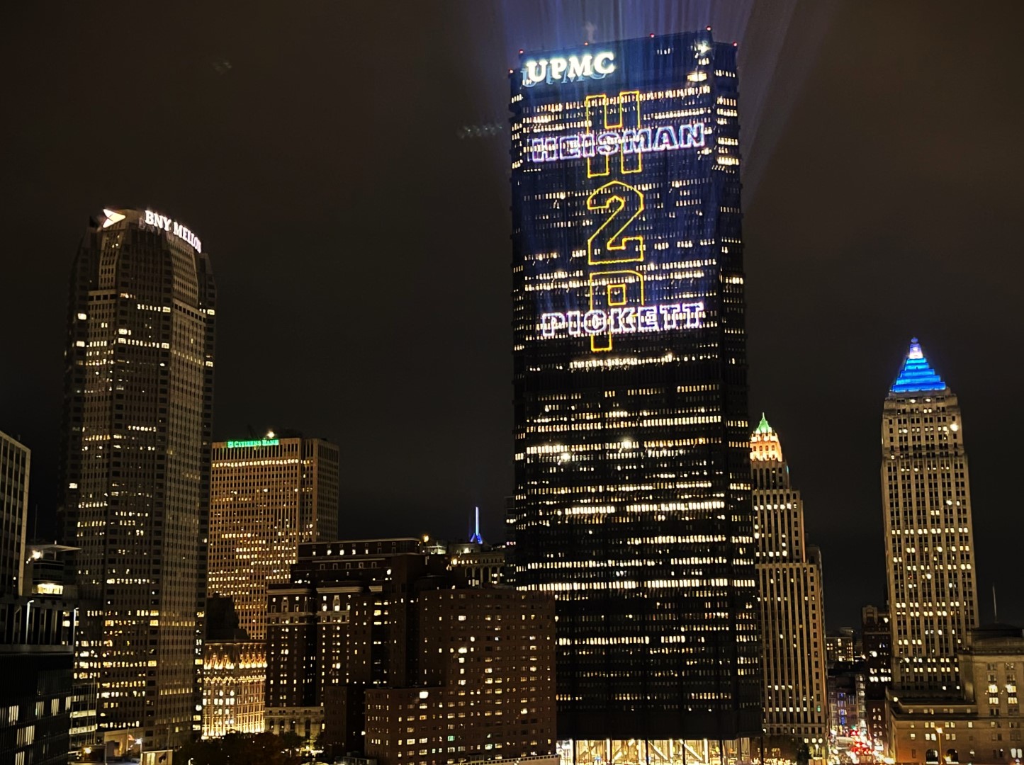 Heisman Laser Projection Lg A laser projection displays a message for Heisman nominee Kenny Pickett in Pittsburgh, PA